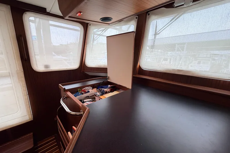 Slide: The Image of Interior of 2022 American Tug 365 with open storage compartment and large windows. - 32