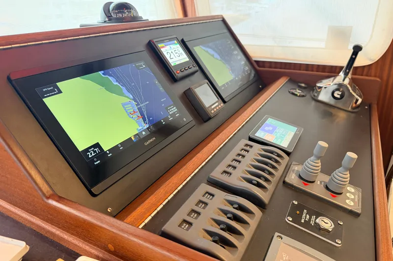 Slide: The Image of American Tug 365 helm with advanced navigation displays and controls, 2022 model. - 34