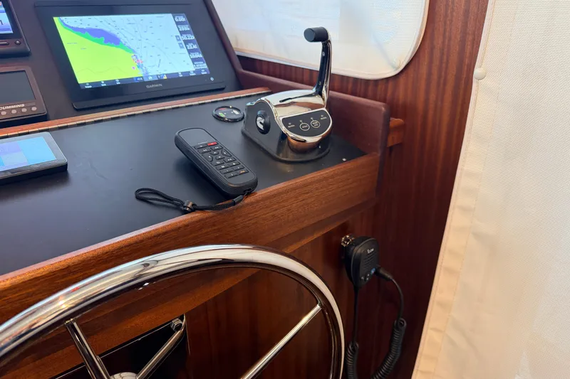 Slide: The Image of Control panel of 2022 American Tug 365 with navigation screen and throttle lever. - 35