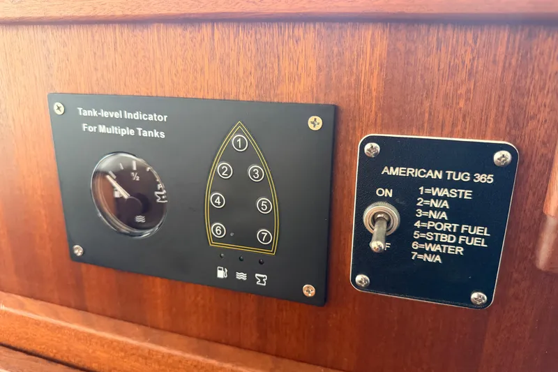 Slide: The Image of Tank-level indicator panel on 2022 American Tug 365 boat dashboard. - 39