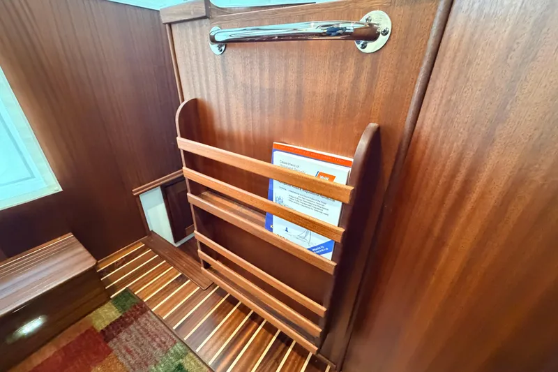 Slide: The Image of Interior of 2022 American Tug 365 with wooden magazine rack and striped flooring. - 41