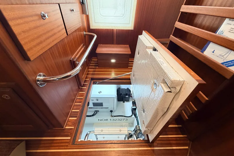 Slide: The Image of Engine room access in 2022 American Tug 365, featuring wooden interior and stainless steel railings. - 42