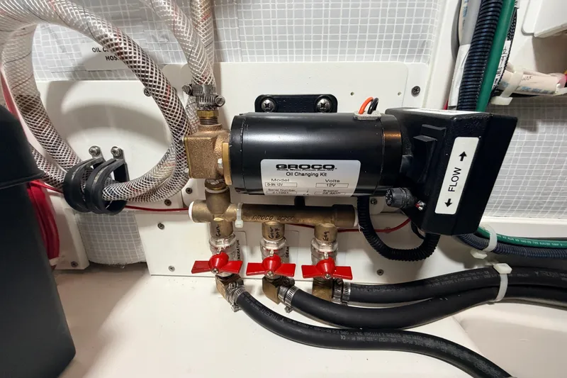 Slide: The Image of American Tug 365 engine room with Groco oil changing kit, 2022 model. - 46
