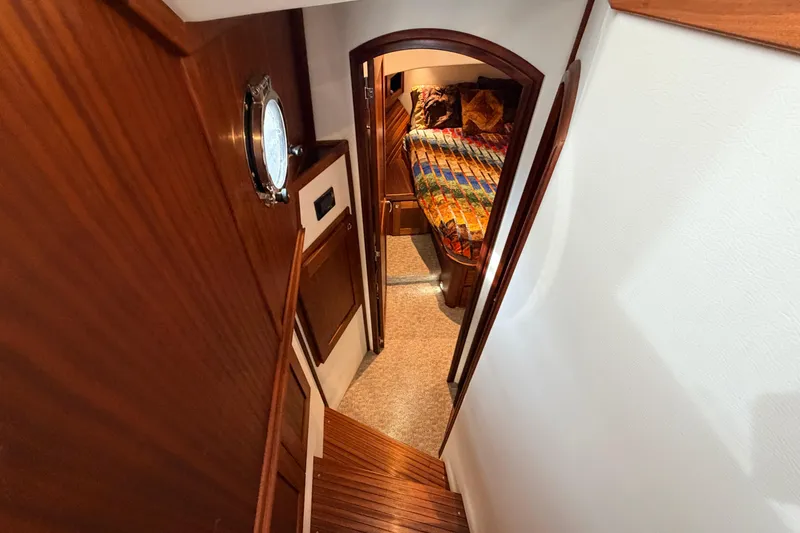 Slide: The Image of Interior view of 2022 American Tug 365, featuring a cozy cabin with wooden finishes. - 48