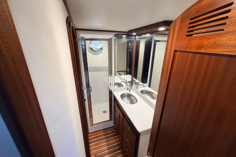 Slide: The Image of Luxurious bathroom in 2022 American Tug 365 with dual sinks and shower. - 62