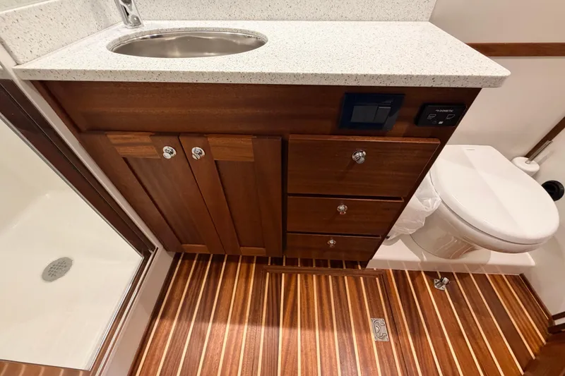 Slide: The Image of Luxurious bathroom in 2022 American Tug 365 with wood cabinetry and modern fixtures. - 67
