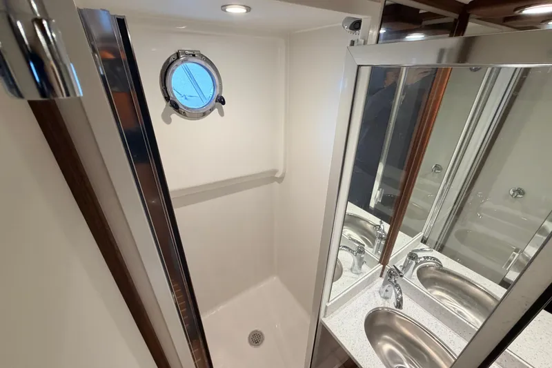 Slide: The Image of Modern bathroom in 2022 American Tug 365 yacht with shower and dual sinks. - 68