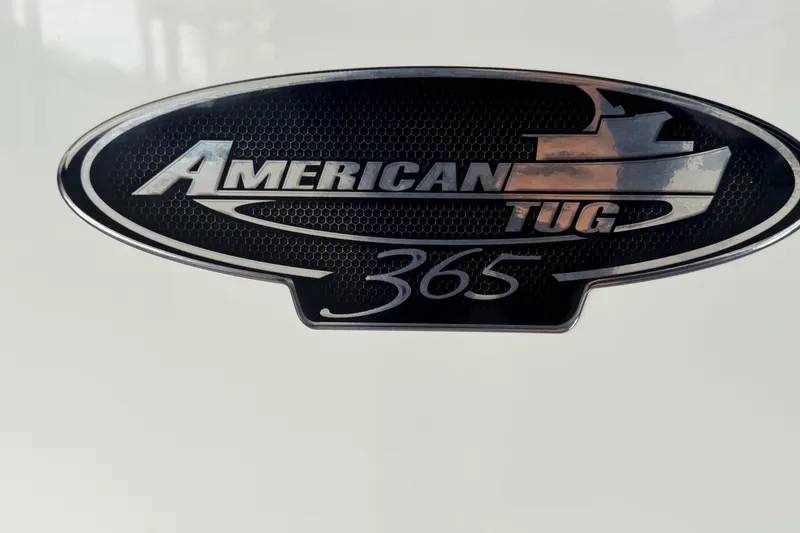 Slide: The Image of American Tug 365 emblem on a 2022 model boat, showcasing brand and model details. - 75