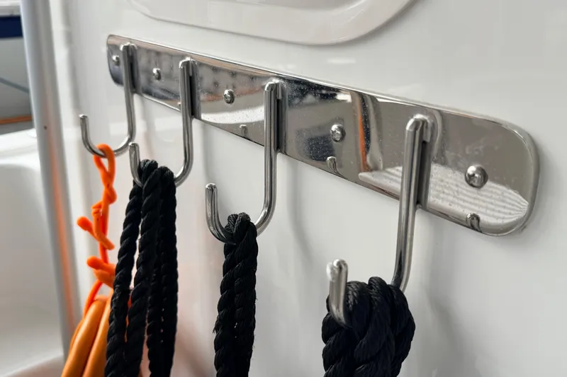 Slide: The Image of Stainless steel hooks with ropes on a 2022 American Tug 365 boat. - 77