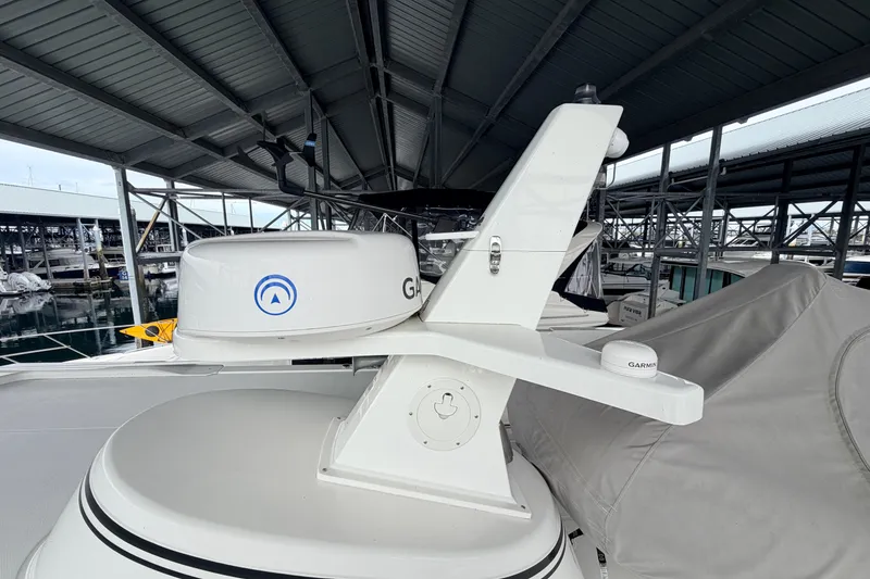 Slide: The Image of American Tug 365 (2022) with Garmin radar system under marina roof. - 85