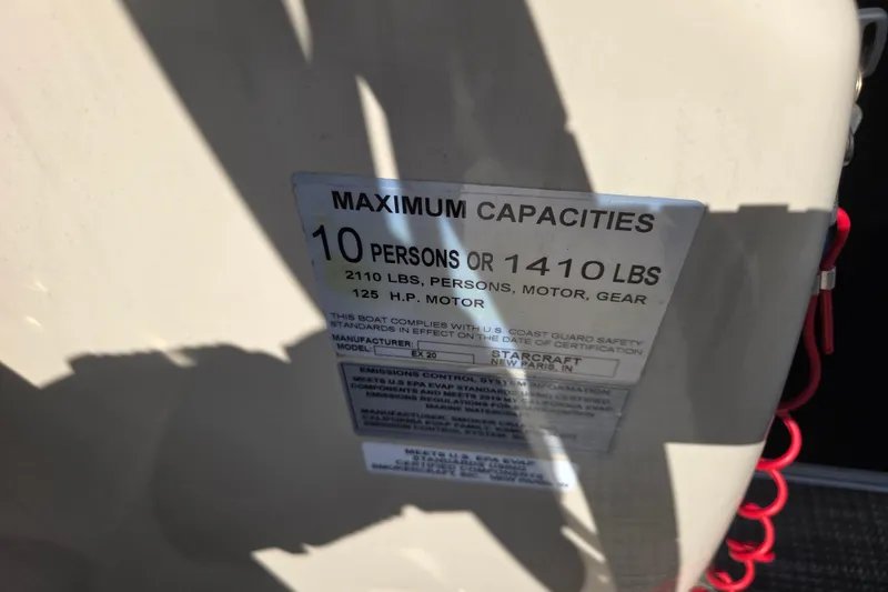 Slide: The Image of 2019 Starcraft EX 20 CF capacity label, 10 persons or 1410 lbs, 125 HP motor. - 11