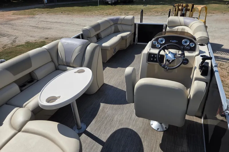 Slide: The Image of Luxurious interior of 2019 Starcraft EX 20 CF pontoon boat with plush seating and helm. - 15