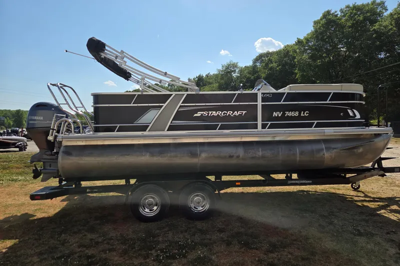 Slide: The Image of 2019 Starcraft EX 20 CF pontoon boat on trailer, featuring Yamaha outboard motor. - 3