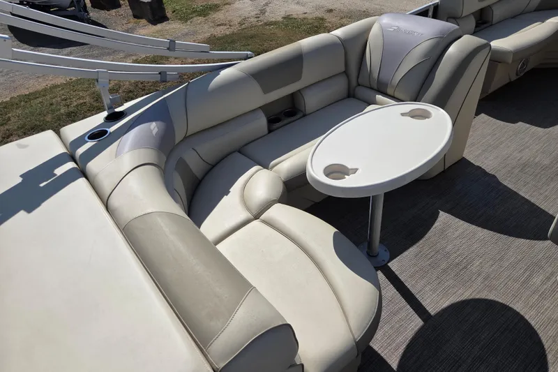 Slide: The Image of Luxurious seating area on a 2019 Starcraft EX 20 CF pontoon boat with a round table. - 8