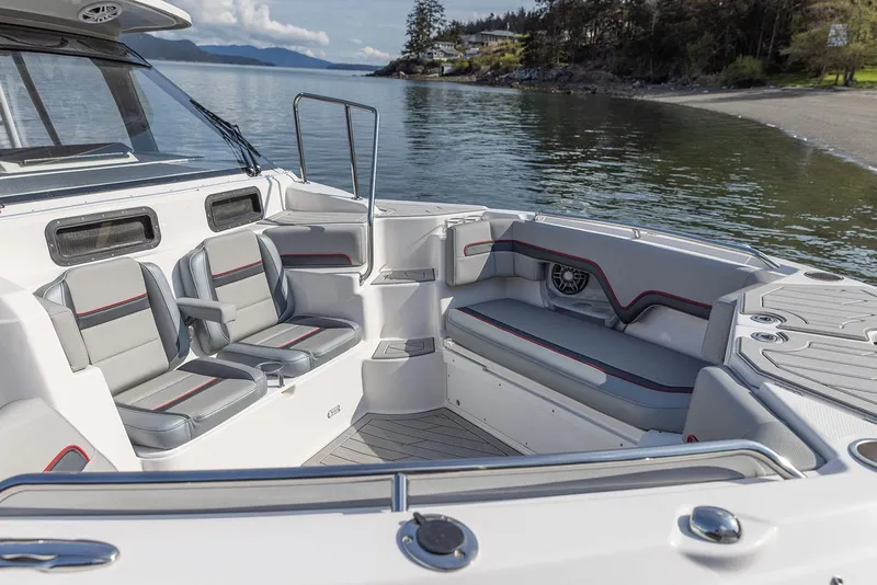 Slide: The Image of Manufacturer Provided Image: Luxurious 2025 Solara S-310 CW boat interior with spacious seating by a serene lake. - 17