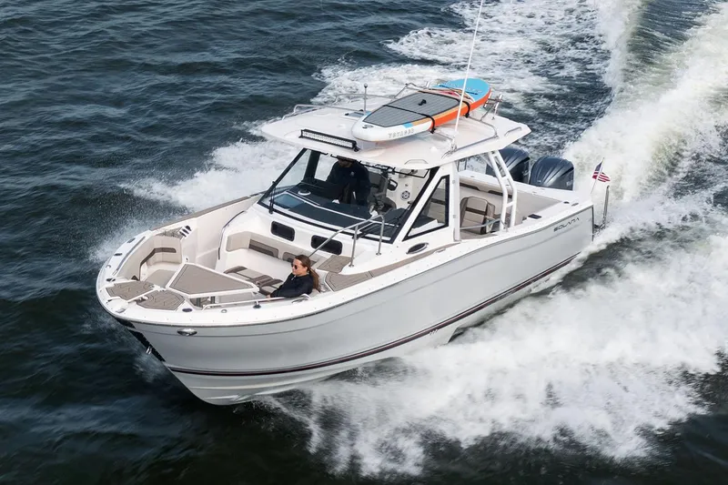 Slide: The Image of Manufacturer Provided Image: 2025 Solara S-310 CW boat cruising on open water, featuring sleek design and modern amenities. - 7