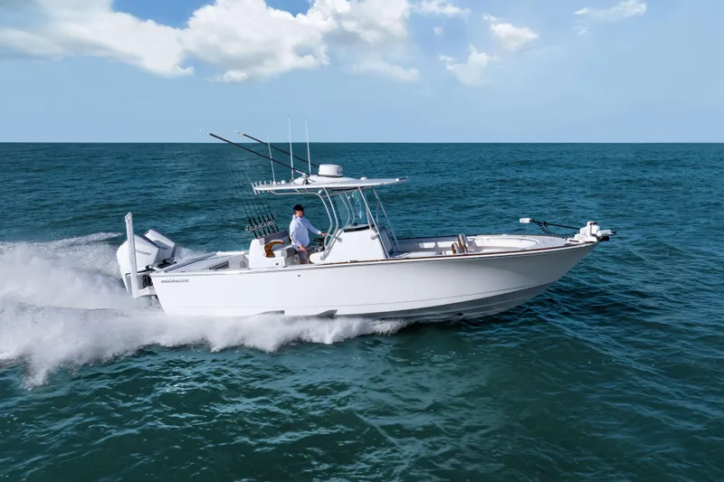 Slide: The Image of 2026 Valhalla Boatworks V-29 Hybrid cruising on open sea under clear skies. - 2