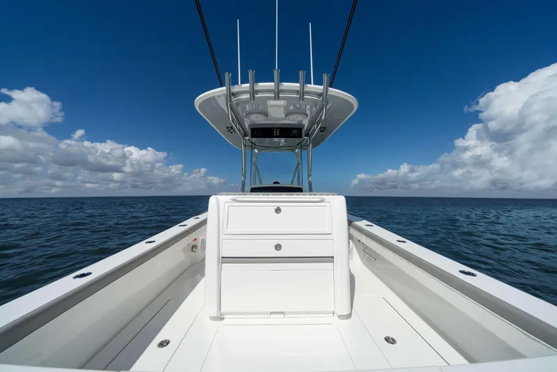 Slide: The Image of 2026 Valhalla Boatworks V-29 Hybrid on open sea under clear blue sky. - 6