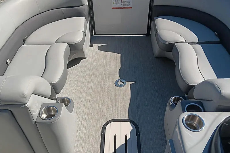 Slide: The Image of Interior of 2023 Veranda Relax VR22RC with gray seating and cup holders. - 3