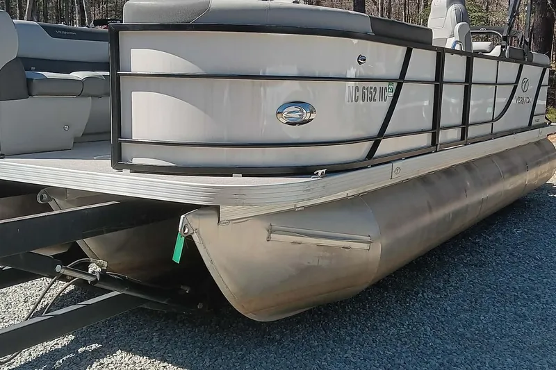 Slide: The Image of 2023 Veranda Relax VR22RC pontoon boat on gravel surface. - 7