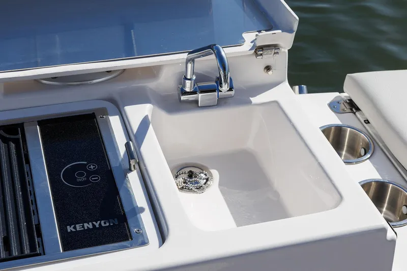 Slide: The Image of Manufacturer Provided Image: Outdoor sink and grill on 2025 Solara S-250 Coupe boat. - 16
