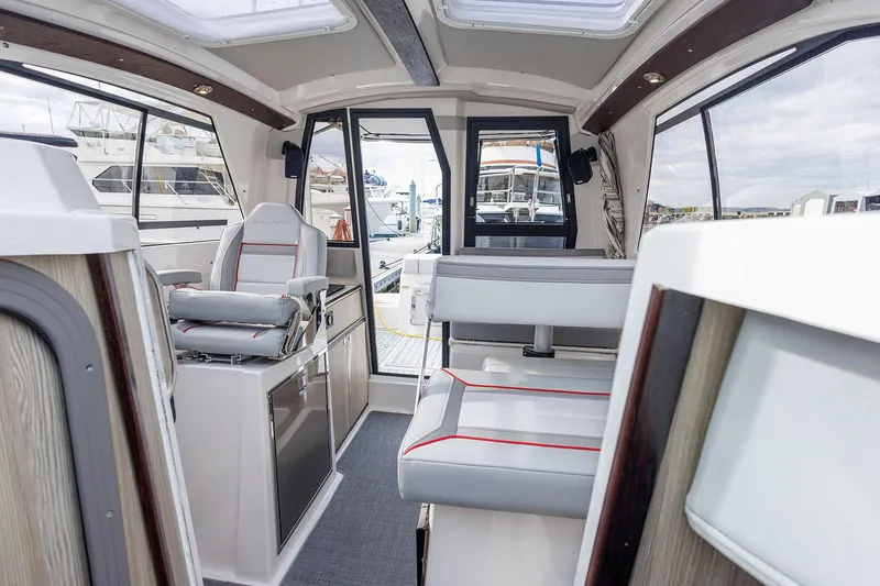 Slide: The Image of Manufacturer Provided Image: Interior of 2025 Solara S-250 Coupe boat, featuring modern seating and sleek design. - 9