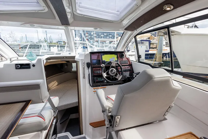 Slide: The Image of Manufacturer Provided Image: Interior of 2025 Solara S-250 Coupe boat with modern helm and seating. - 10