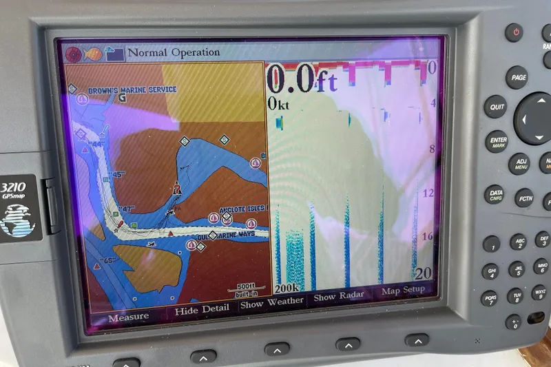 Slide: The Image of Navigation display on 1987 Albin 36 Trawler showing marine chart and sonar data. - 16