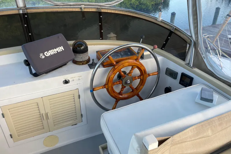 Slide: The Image of Helm of 1987 Albin 36 Trawler with Garmin navigation system and wooden steering wheel. - 26