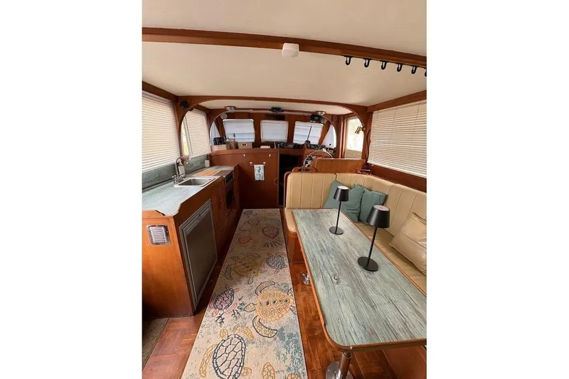 Slide: The Image of Interior of 1987 Albin 36 Trawler with cozy seating and nautical decor. - 3