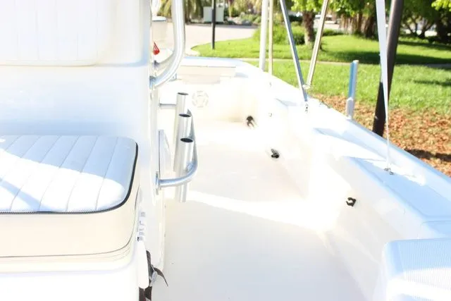 Slide: The Image of Interior view of 2017 Mako 21 LTS boat, white upholstery and fittings. - 13