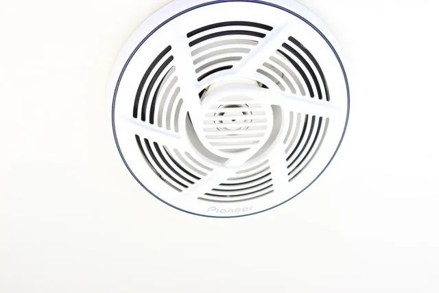 Slide: The Image of Round white ceiling speaker with Pioneer logo, close-up view. - 16