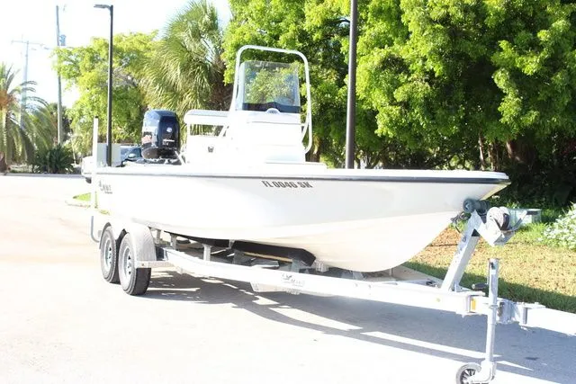 Slide: The Image of 2017 Mako 21 LTS boat on trailer, sunny day. - 5