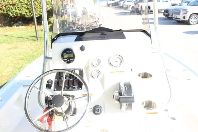 Slide: The Image of Cockpit of a 2017 Mako 21 LTS boat outdoors. - 9