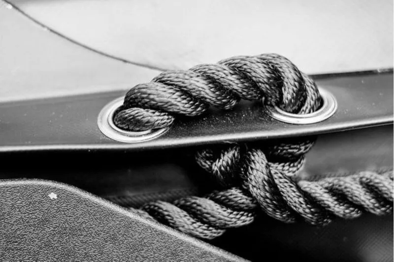 Slide: The Image of Close-up of a black rope threaded through metal eyelets on a Stryker LX 360, 2026 model. - 11