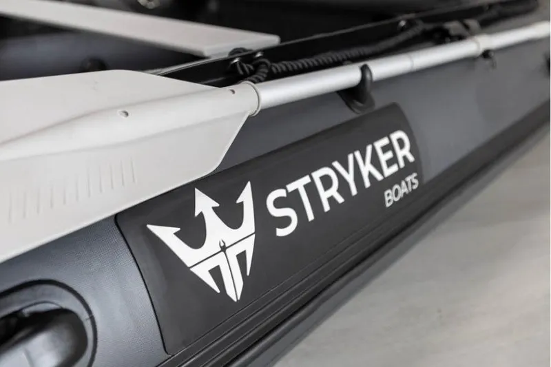 Slide: The Image of Close-up of Stryker LX 360 boat logo, featuring sleek design and branding. - 7