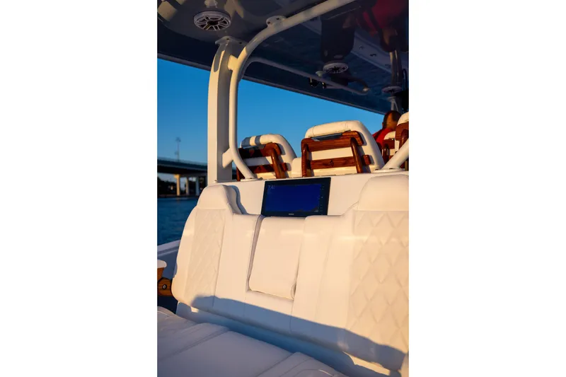 Slide: The Image of Luxurious interior of 2027 Freeman 42LR boat with white seating and digital display. - 3