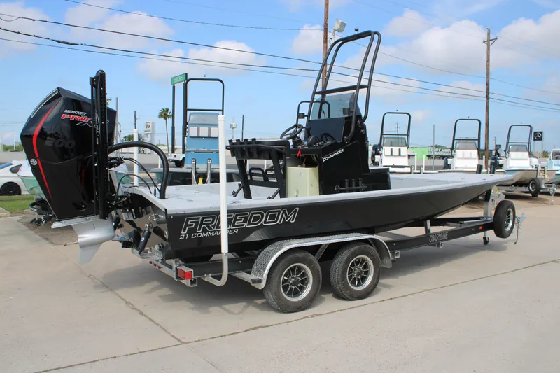 Slide: The Image of 2026 Freedom Boats 21' Commander on trailer, featuring a powerful Mercury Pro XS engine. - 10