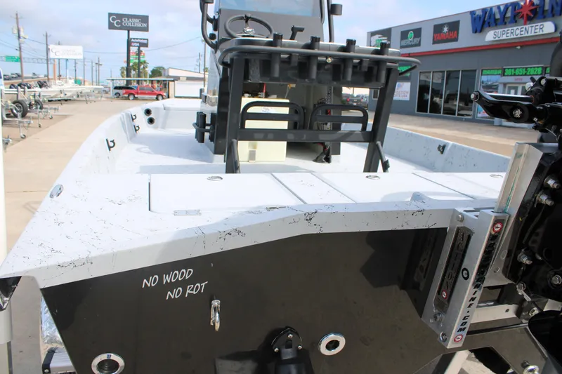 Slide: The Image of 2026 Freedom Boats 21' Commander at dealership, showcasing durable construction and modern design. - 11