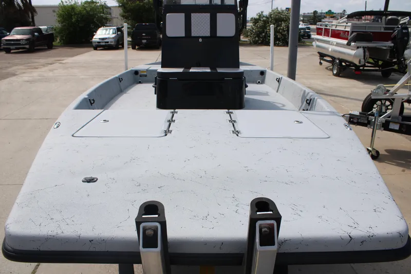 Slide: The Image of 2026 Freedom Boats 21' Commander, spacious deck view, parked outdoors. - 13