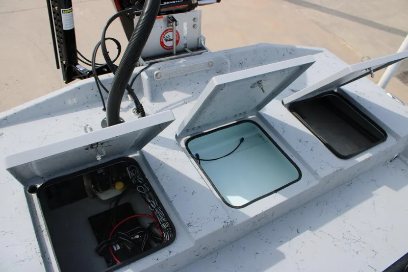 Slide: The Image of Open storage compartments on a 2026 Freedom Boats 21' Commander. - 14