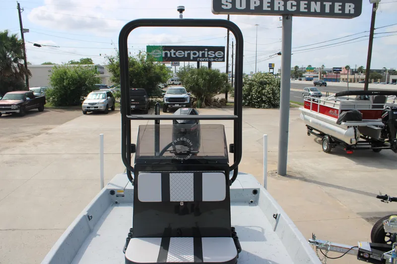 Slide: The Image of 2026 Freedom Boats 21' Commander at dealership, showcasing sleek design and modern features. - 15