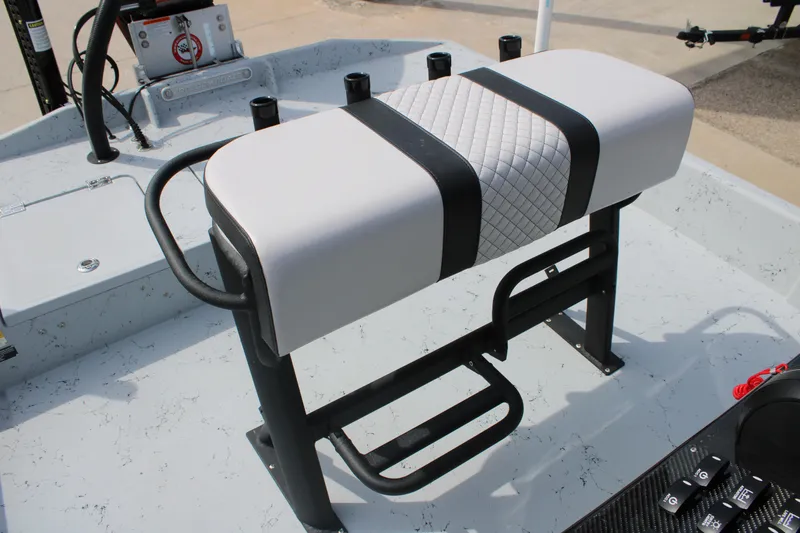 Slide: The Image of 2026 Freedom Boats 21' Commander interior with cushioned seating and control panel. - 18