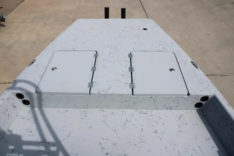 Slide: The Image of 2026 Freedom Boats 21' Commander deck with storage compartments and speckled finish. - 19