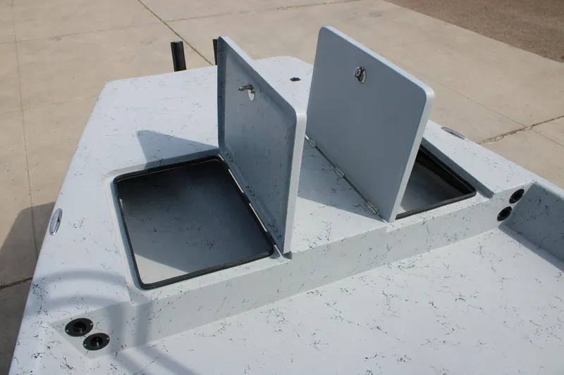 Slide: The Image of 2026 Freedom Boats 21' Commander with open storage compartments on deck. - 20