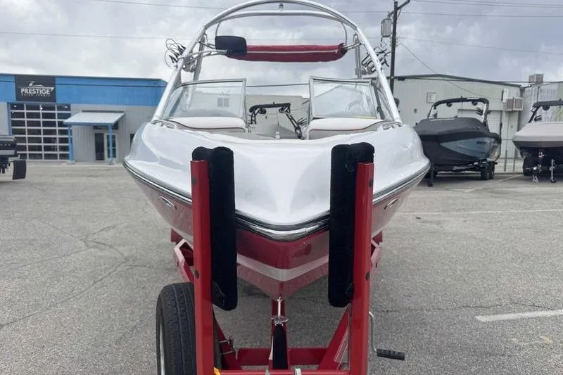 Slide: The Image of 2006 Tigé 22Ve boat on trailer in parking lot, front view. - 4