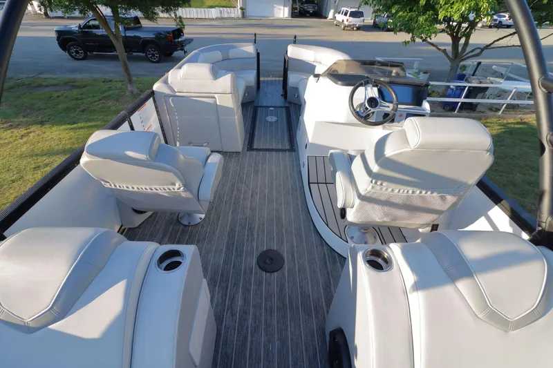 Slide: The Image of 2021 Montara Surf Boss 2.0 25 boat interior with luxurious seating and steering console. - 10