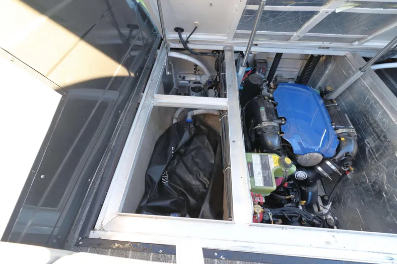 Slide: The Image of Engine compartment of 2021 Montara Surf Boss 2.0 25 boat, showcasing mechanical components. - 16