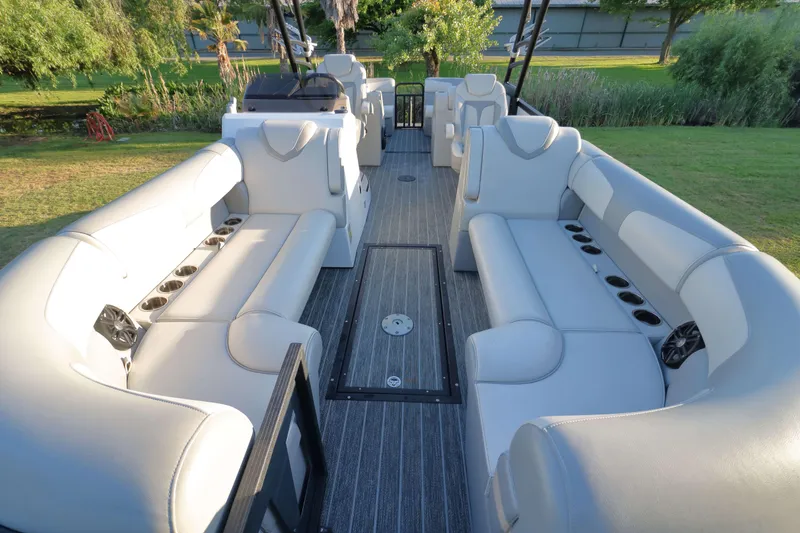 Slide: The Image of 2021 Montara Surf Boss 2.0 25 boat interior with spacious seating and cup holders. - 7