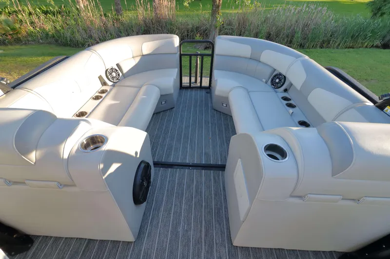 Slide: The Image of Luxurious seating on 2021 Montara Surf Boss 2.0 25 boat, featuring cup holders and speakers. - 9